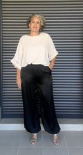 Pantalón bombacho satinado negro - vista frontal